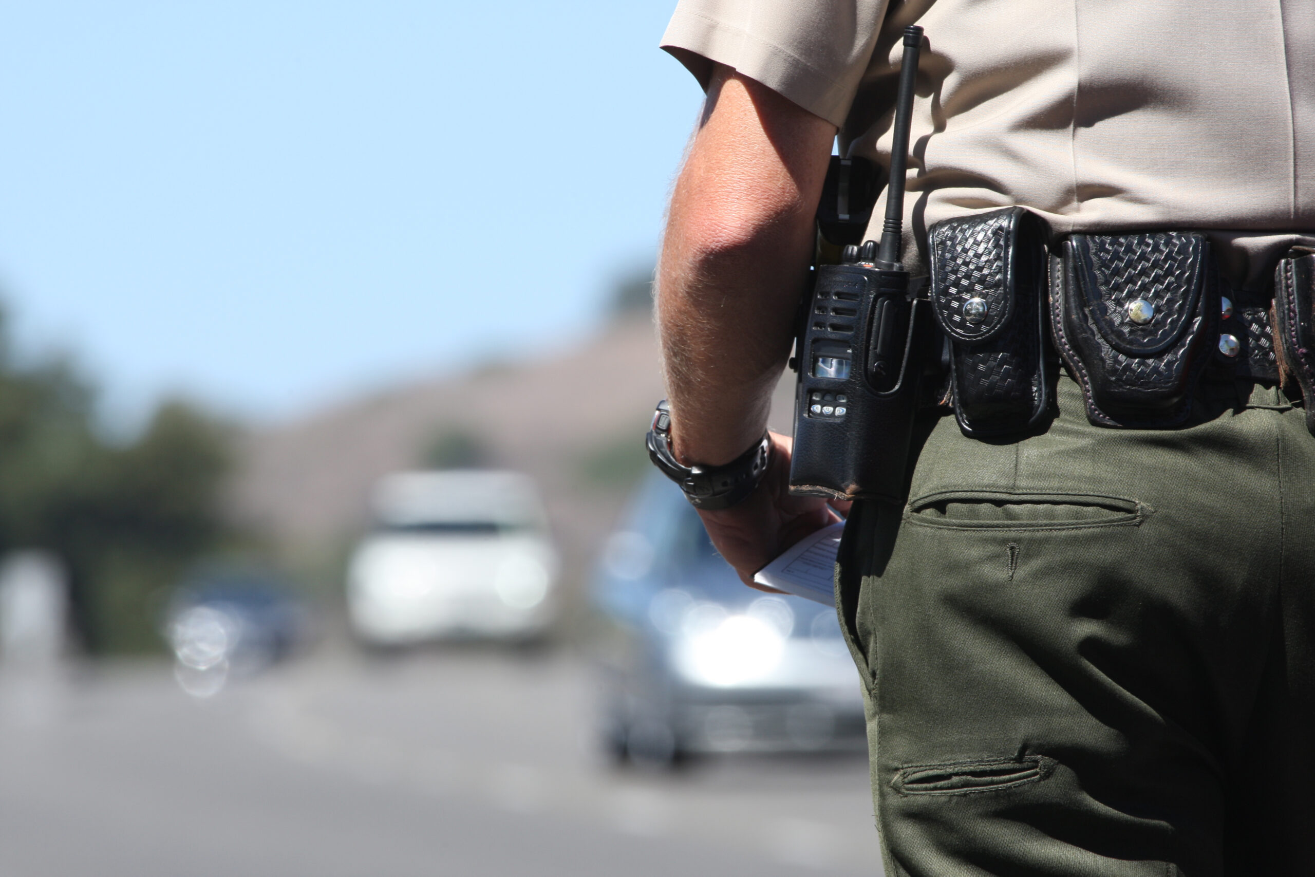 A police officer standing by traffic